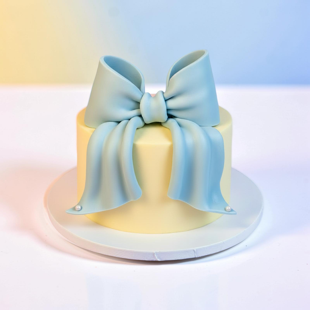 Cake with a large blue bow on a gradient background