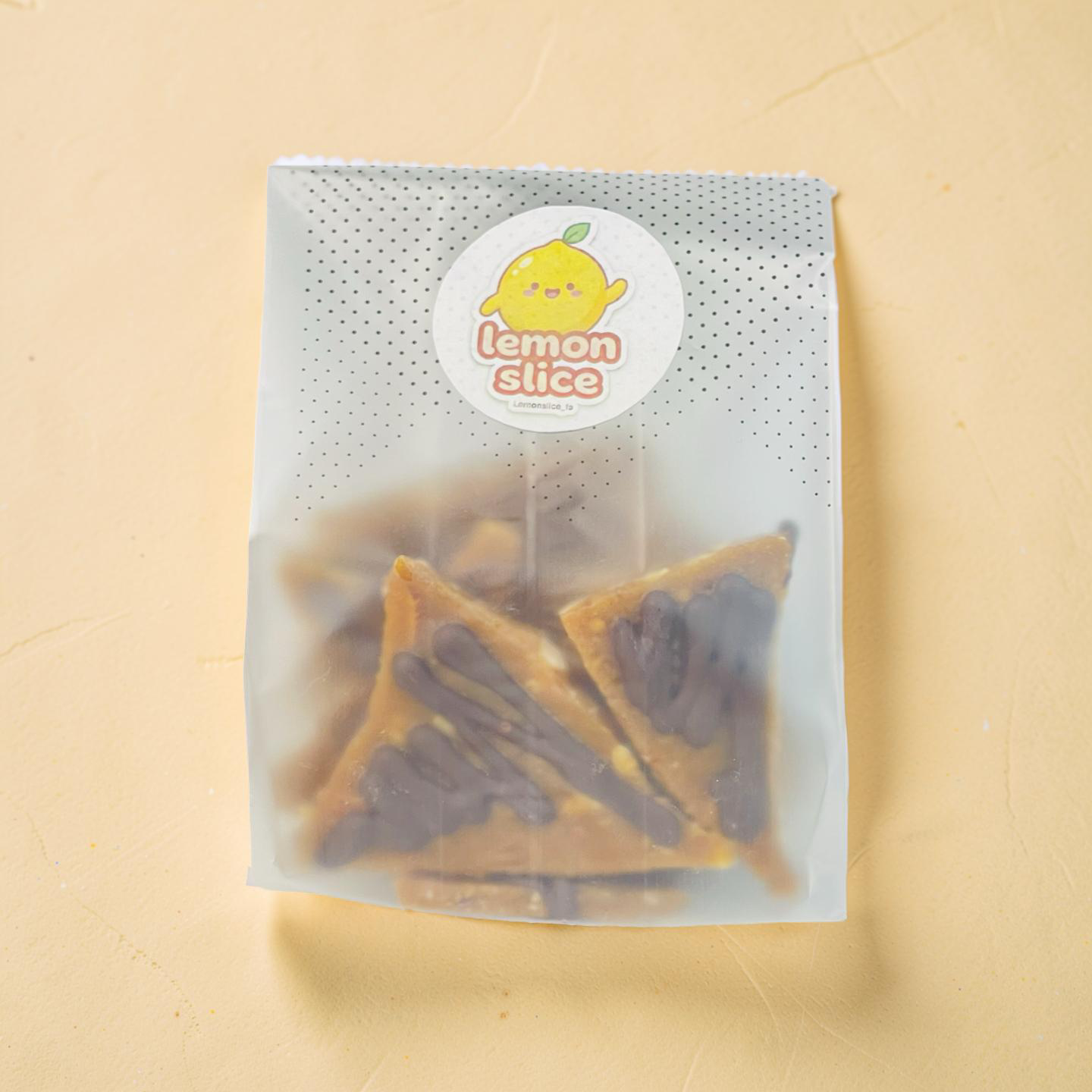Packaged snacks with a 'Lemonslice' label on a beige background