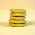 Stack of green cookies on a yellow background