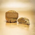 Two cookies, one whole and one cut in half, on a gold background with 'Lotus' branding.