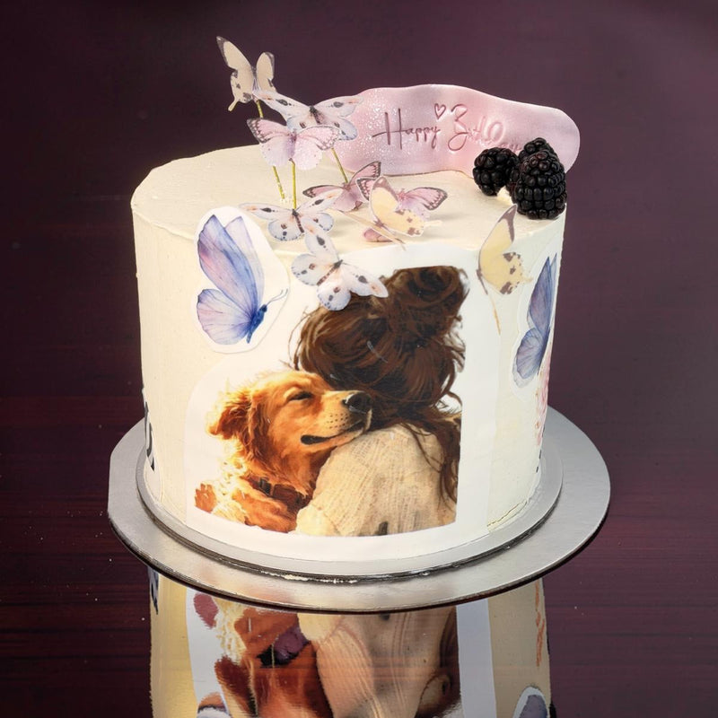 Decorative cake with a photo of two dogs on a dark background